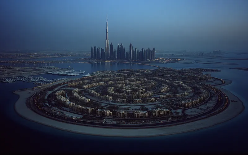 Burj Khalifa piercing clouds, Palm Jumeirah’s fronds, neon-lit marina. Arid dunes embrace the metropolis, veins of traffic pulsing below. Sparkling coastline meets ambition, where desert whispers meld with steel giants. Dubai--a mirage made real.  --sref 469710847