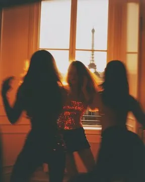 Photo of three women dance in sequined disco clothing, early morning in parisian apartment, cigarette smoke, whimsical haussmannian room with view on eiffel tower --ar 4:5 --style raw --sref 3861771670 3909366337 1763275657 --v 6.1